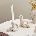 white ceramic taper candle holders